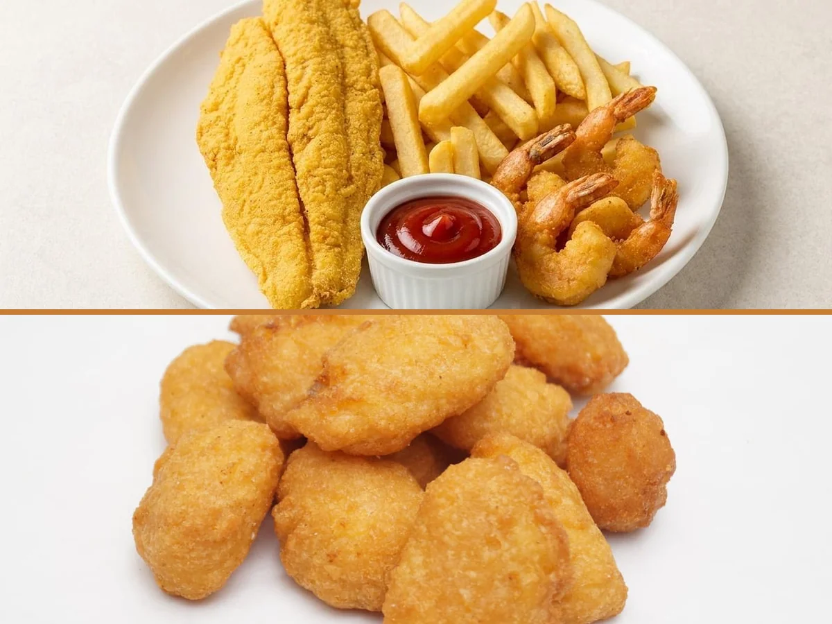 Chicken, fish, and sides ready for serving.