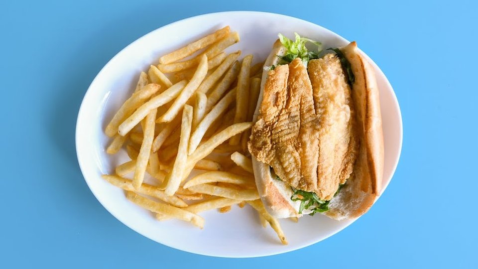 Printed menu with chicken, fish, and side orders.