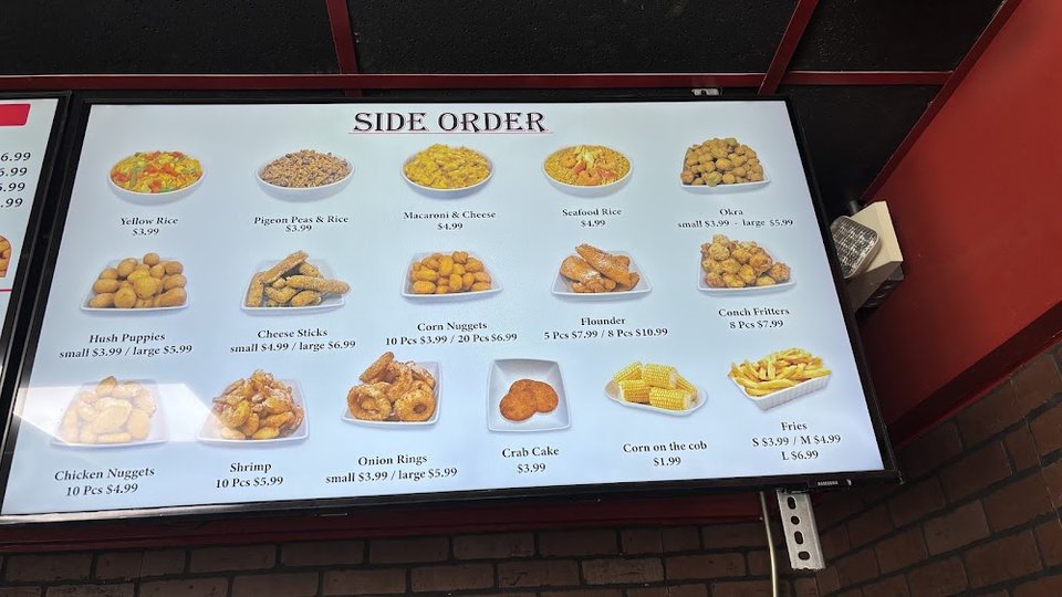 Takeout menu showing wings, nuggets, and fries.
