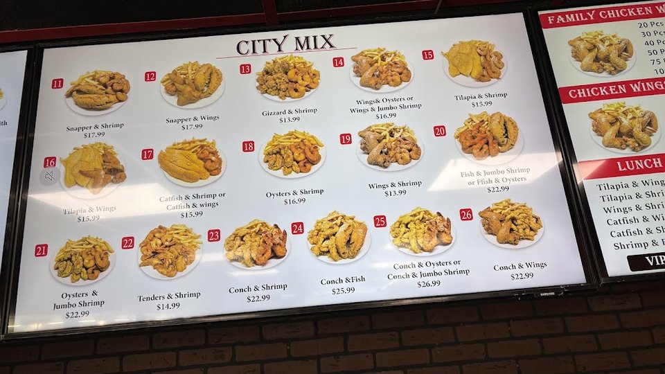 Restaurant menu with seafood and chicken selections.